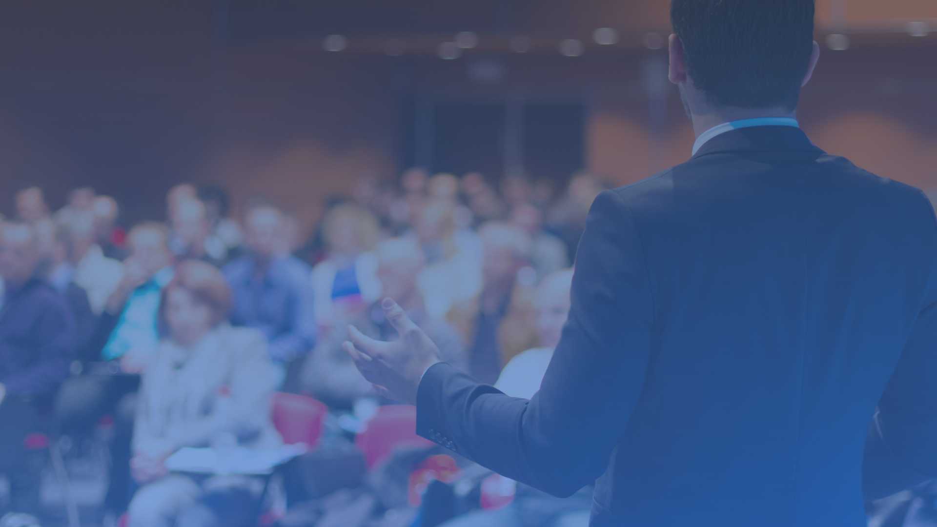 Man on stage in front of audience