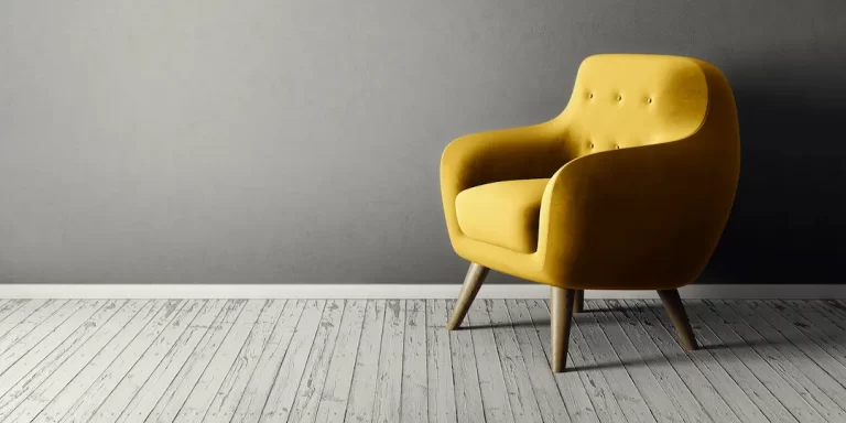 yellow chair on wooden floor